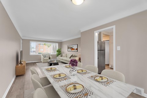Open concept dining and living room with modern furnishings at Oak Park Gardens Apartments, Michigan