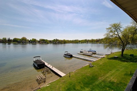 Waterfront boat docks with private access at Cass Lake Shore Club Apartments, Waterford Twp, Michigan