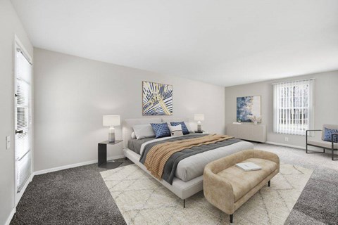 Spacious primary bedroom with modern decor at Glens of Bloomfield Apartments, Bloomfield Hills, Michigan