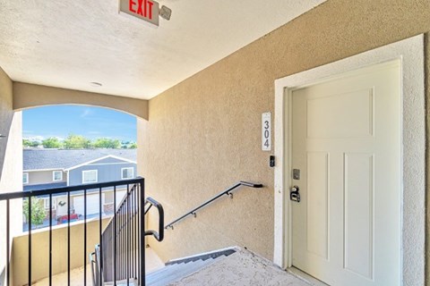 A white door with a black handle is on the right side of the image.