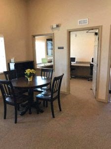 a dining room with a table and chairs