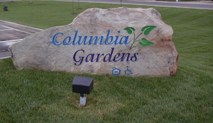 a rock with the words calumbra gardens on it