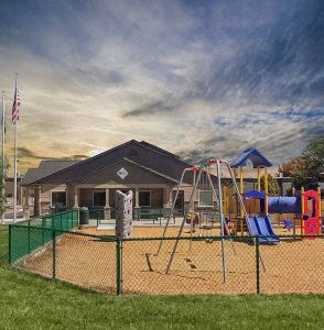 a playground with a swing set and slides