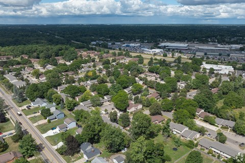 A suburban area with houses and trees.