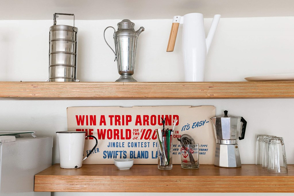 A coffee station with a sign that says "Win a trip around the world for $75".