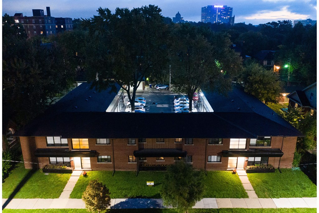 A large building with a pool in the middle of it.