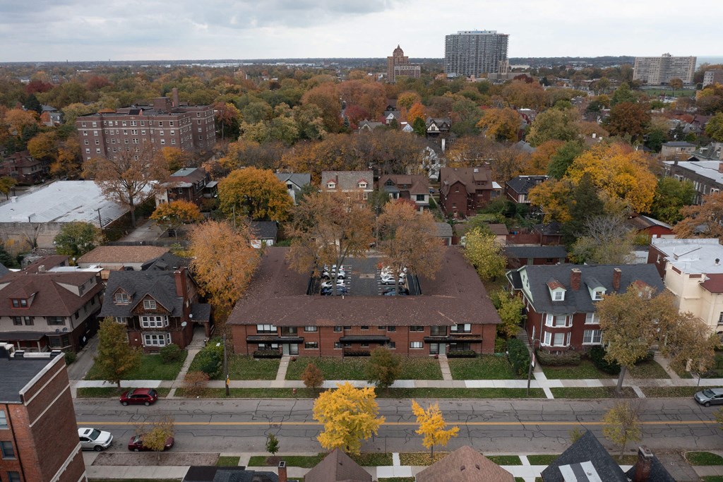 A view of a residential area with houses and trees.