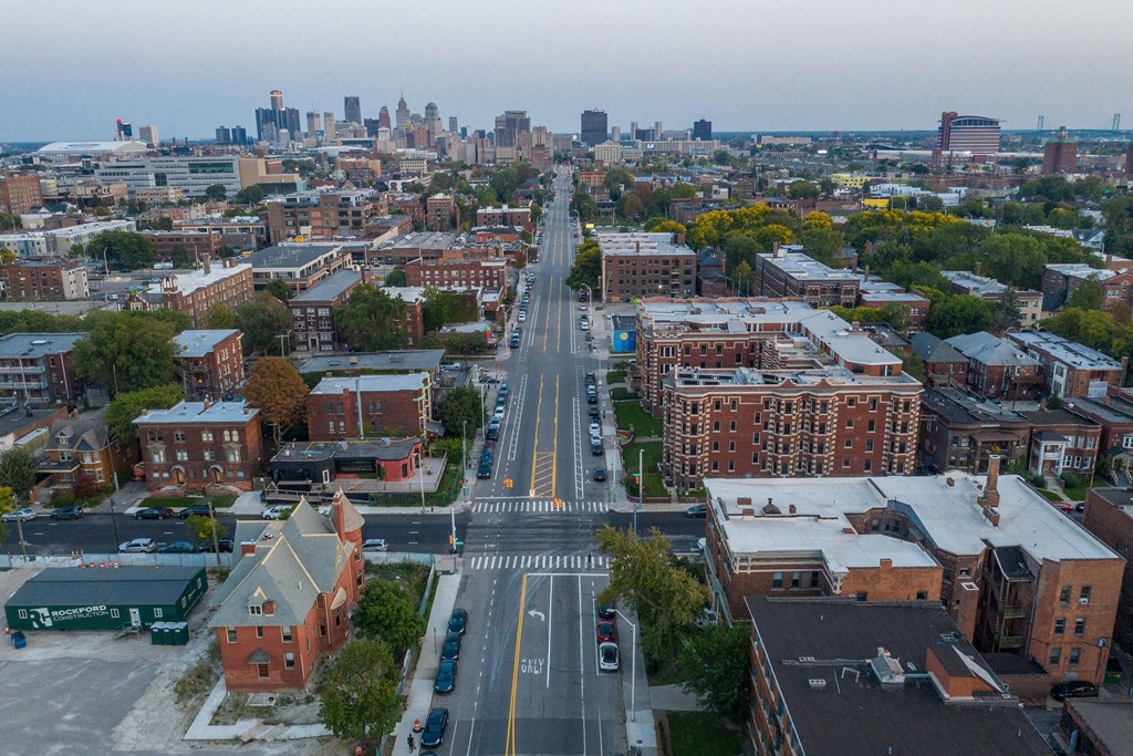 A city street with cars and buildings.