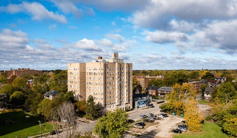 A large building with a parking lot in front of it.