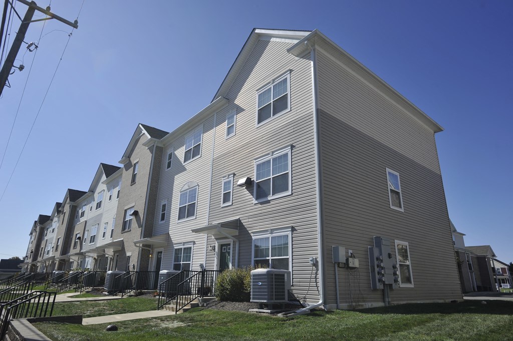 a row of apartment buildings on a city street
