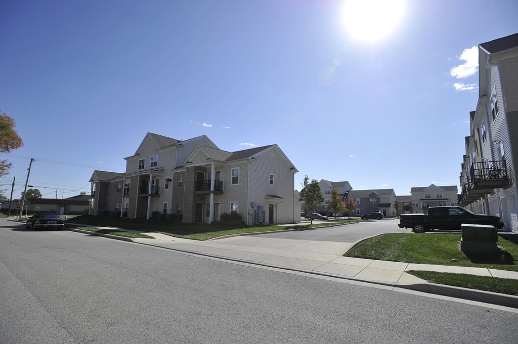 a row of houses on the side of a street