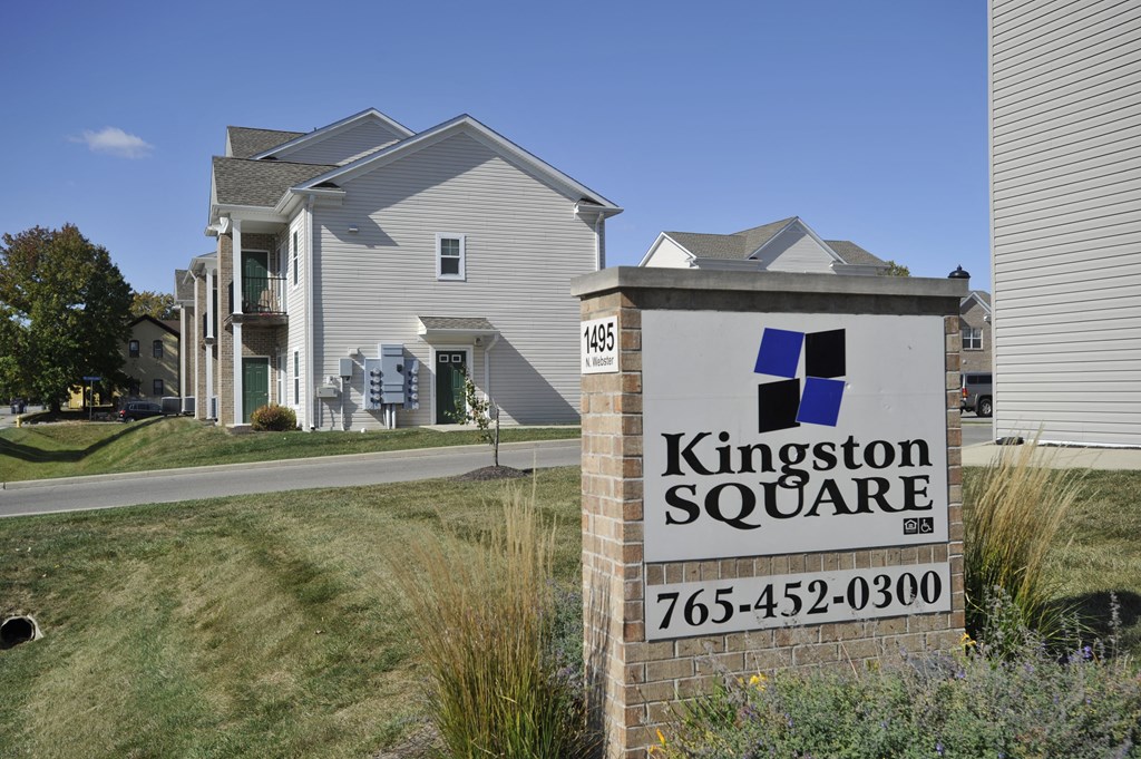 a sign in front of houses