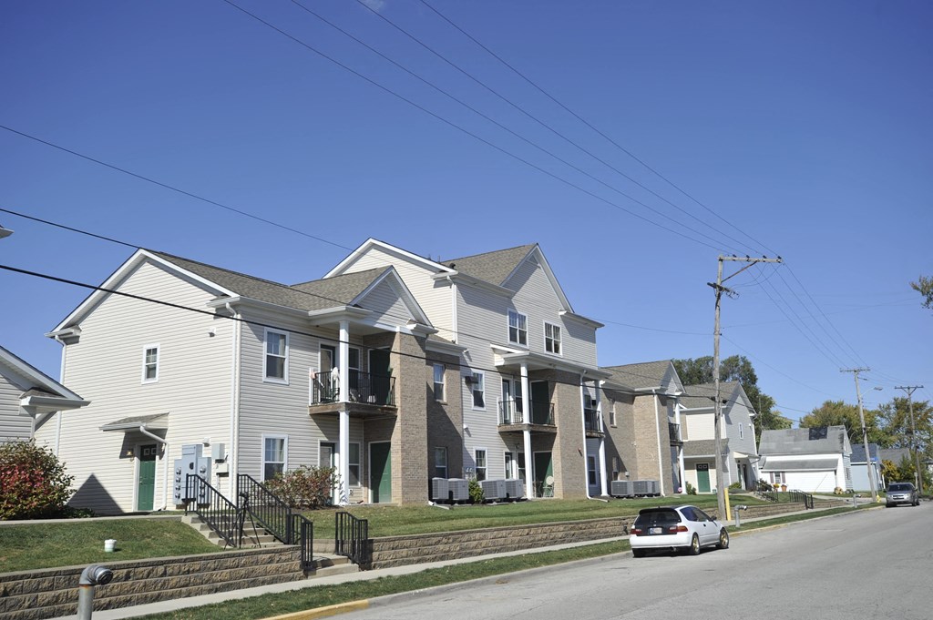 a row of houses on the side of a street