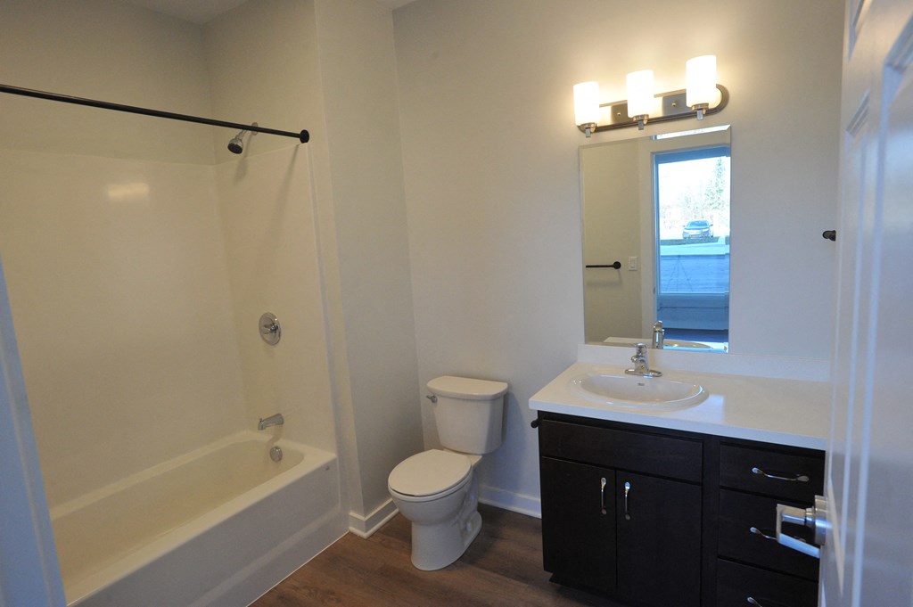 a bathroom with a sink toilet and a bath tub