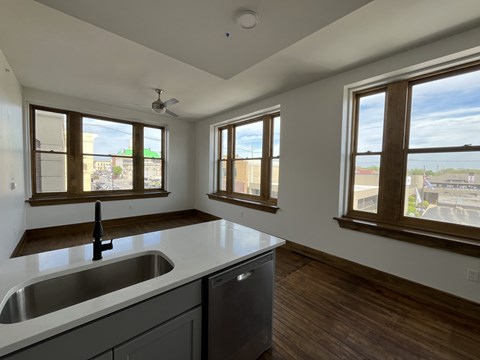 A kitchen with a sink and a window.
