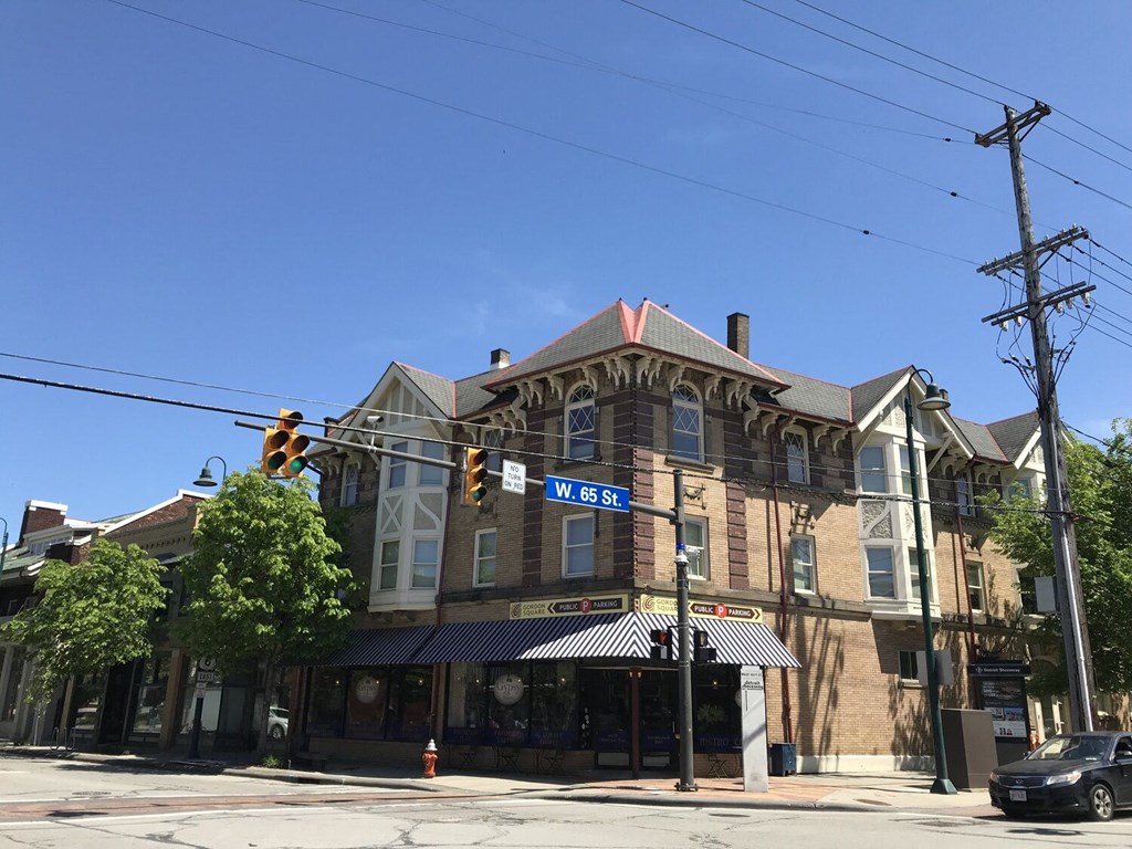 a building on the corner of a street with a traffic light