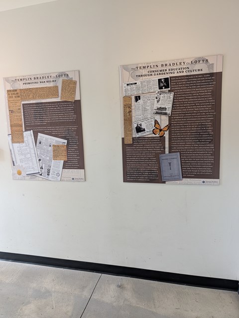 Two posters on a wall with the top one titled "Temple-Bradley-Lofts".