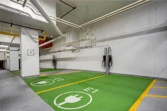 A parking garage with electric vehicle charging stations.