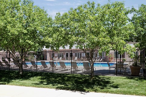 A pool surrounded by trees and a fence. at Standing Bear Lake, Nebraska