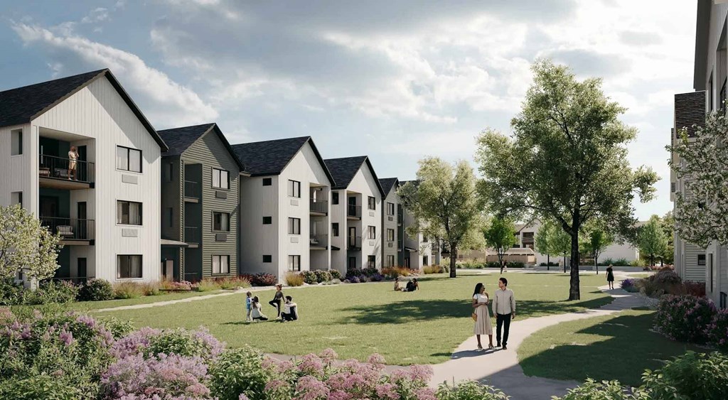 A row of modern houses with people walking in front.