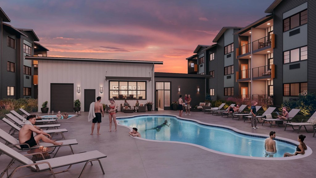 A group of people are enjoying the sun by the pool at a resort.