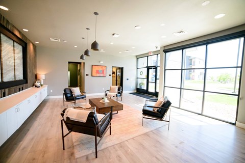 A living room with a brown chair and a brown table.