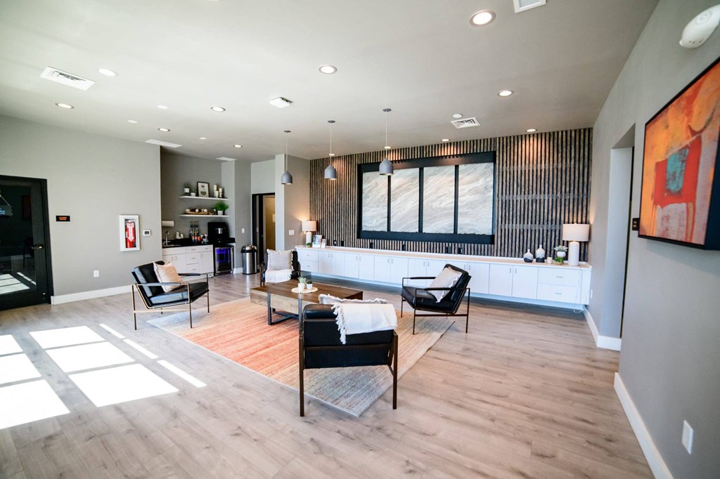 A modern living room with a wooden floor and furniture.