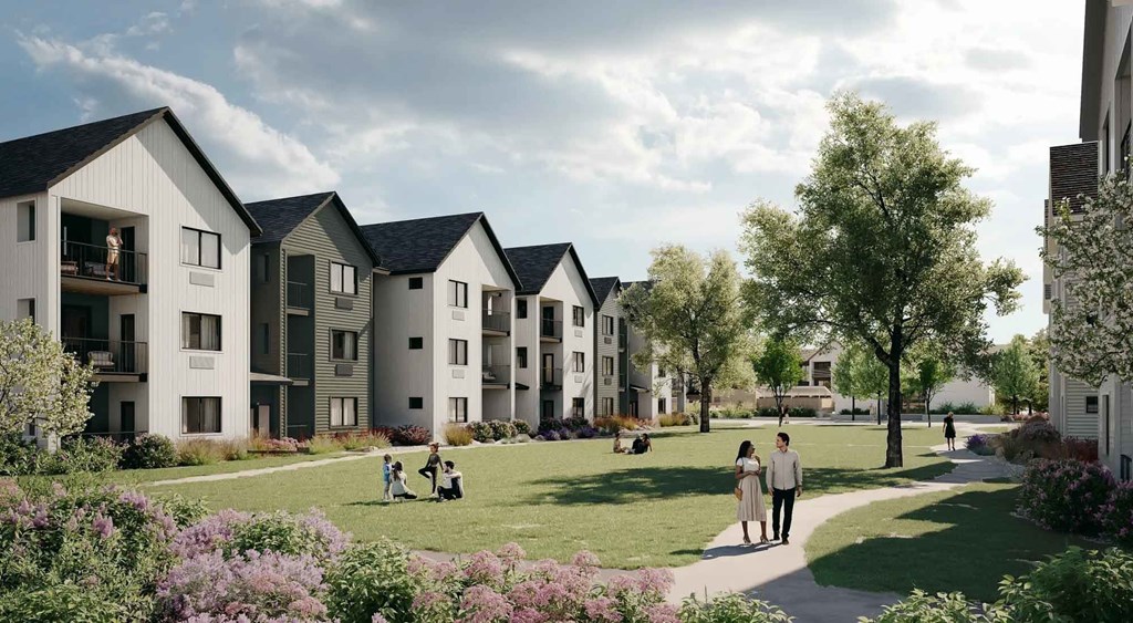 A row of modern houses with people walking in front.