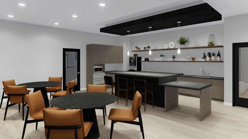 A modern dining room with a black table and chairs.