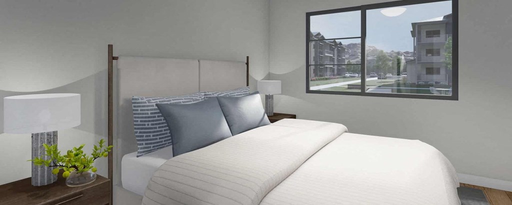 A bedroom with a large bed and a window overlooking a cityscape.