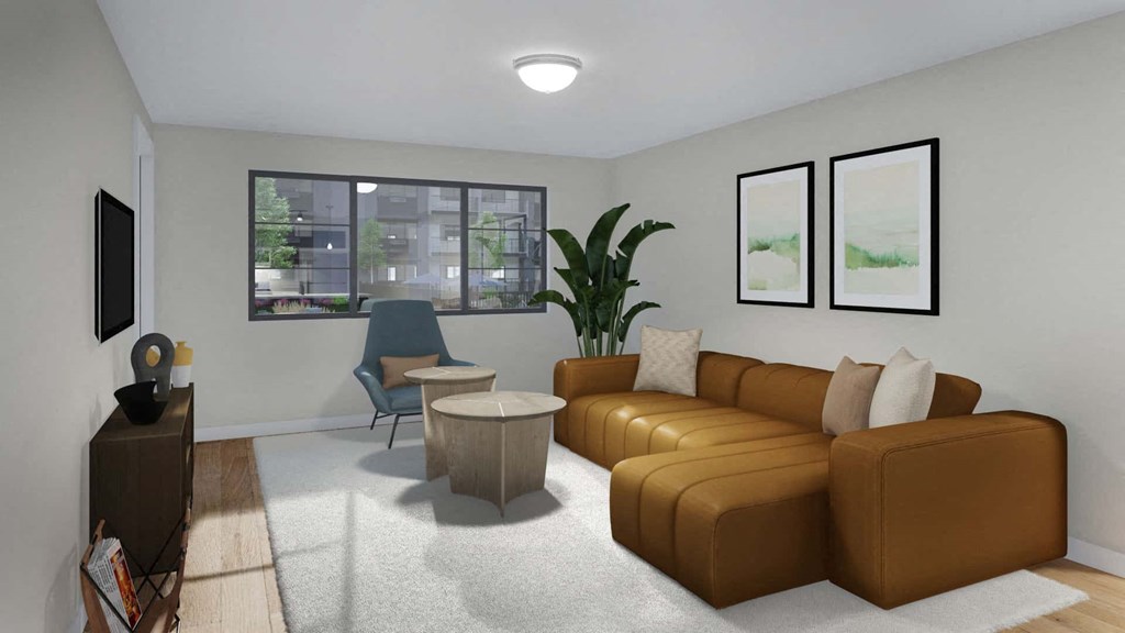 A living room with a brown couch, a blue chair, a white rug, and two framed pictures on the wall.
