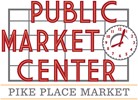 A sign for the Pike Place Market Center with a clock.