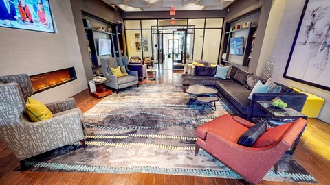 Club Room With Large Screen Tvs And A Fireplace at Civic at Frisco Square Apartments, Frisco, TX, Texas