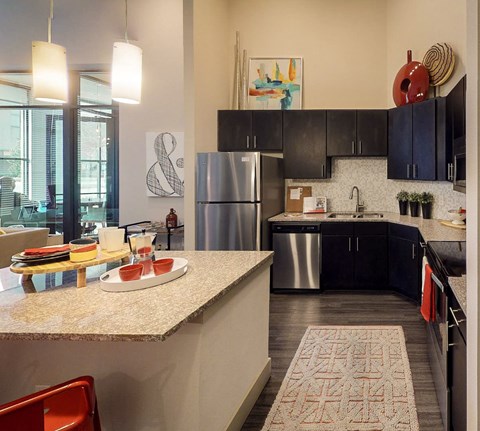 Fully Equipped Kitchen With Modern Appliances at Civic at Frisco Square Apartments, Texas