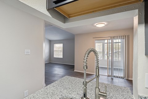 A kitchen with a sink and a window.