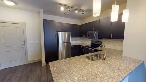 Kitchen With Custom Maple Cabinetry at Civic at Frisco Square Apartments, Frisco, 75034