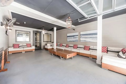 A living room with a couch and a table.