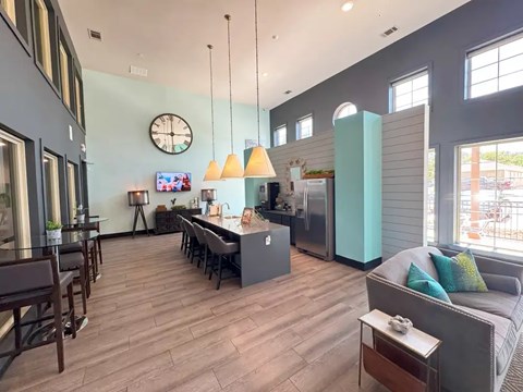 A modern kitchen with a dining table and chairs.