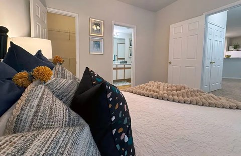 Bedroom with ensuite bathroom and walk-in closet at Indian Creek Apartments, Texas, 75165