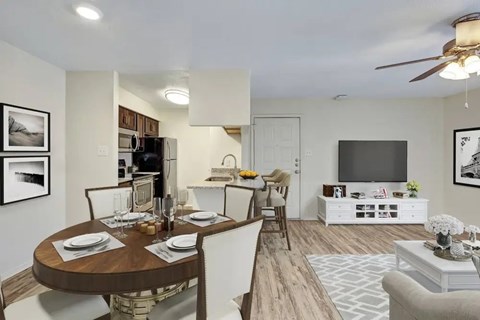 Open floor plan with dining area and kitchen at Village Green Apartments, San Marcos, TX 78666