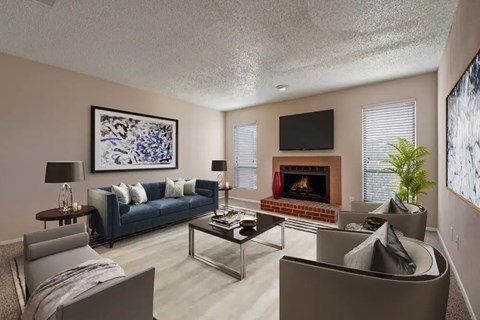 Living room with fireplace and modern furnishings at Valley Creek Apartments, Garland, TX 75043