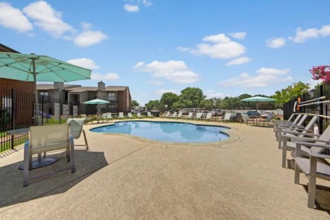 Resort style swimming pool with sun deck at South Meadows Apartments, Red Oak