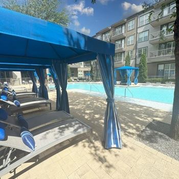 Pergola near a swimming pool at Civic at Frisco Square Apartments, Frisco, Texas