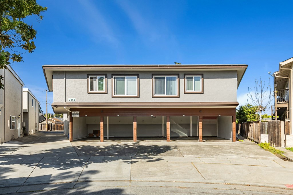 A modern house with a grey facade and a garage.