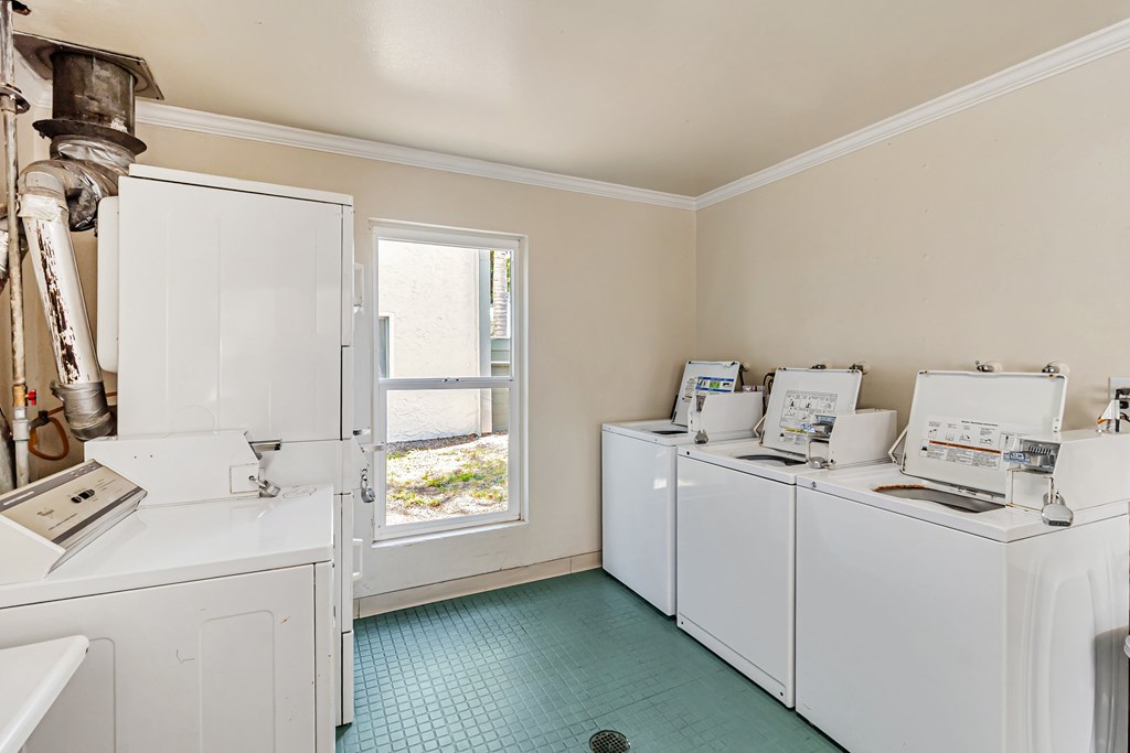 A laundry room with a washer and dryer in it.