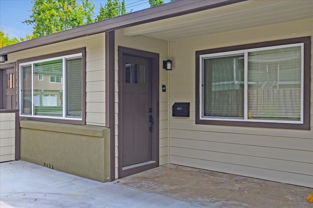 the front door of a home with a porch