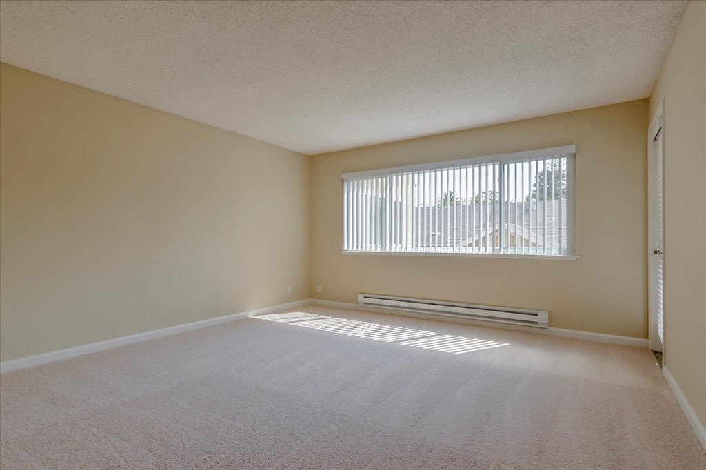 an empty room with a large window