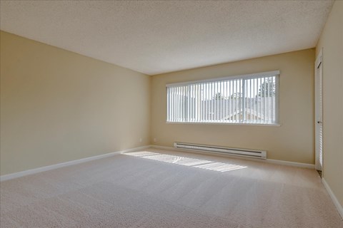 an empty room with a large window