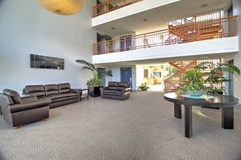 Lobby with sofas and TV full area at Madison Place, California, 94403