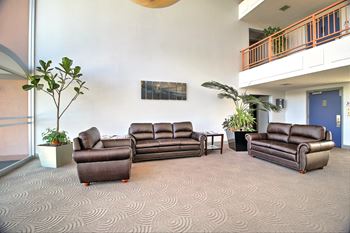 Lobby with sofas and TV at Madison Place, California